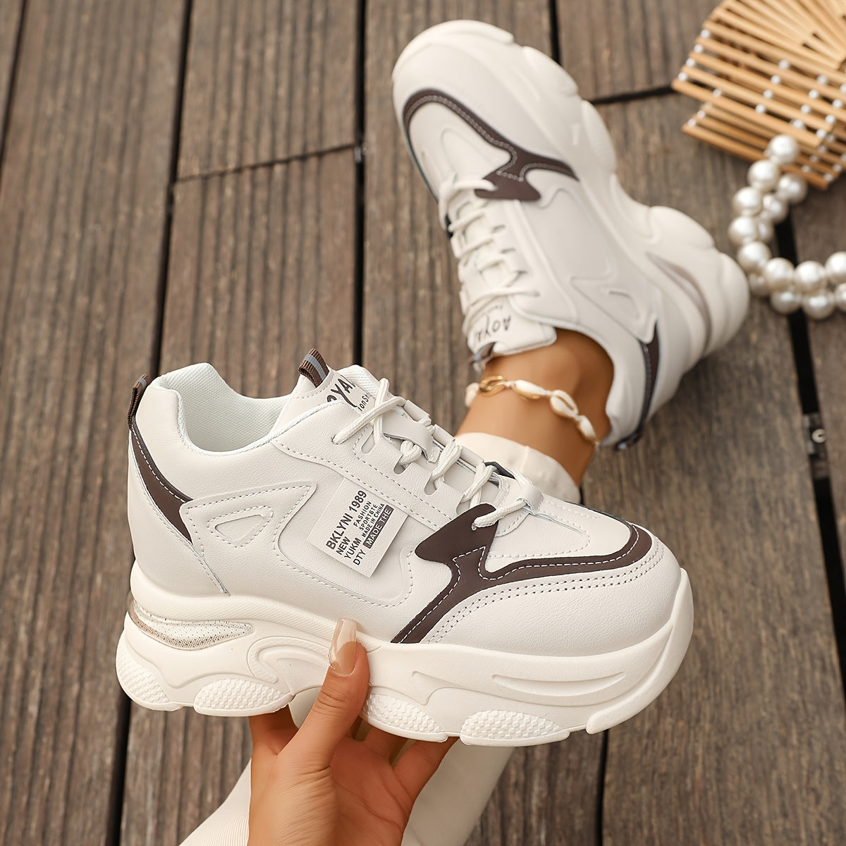 Chunky sneakers for women featuring a casual lace-up design and trendy wedge sports shoes.