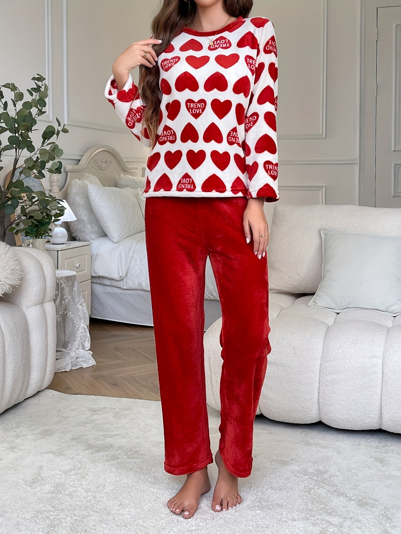 Cozy lounge set for women featuring heart and letter print, perfect for fall and winter. Includes long sleeve top and pants with a relaxed fit.