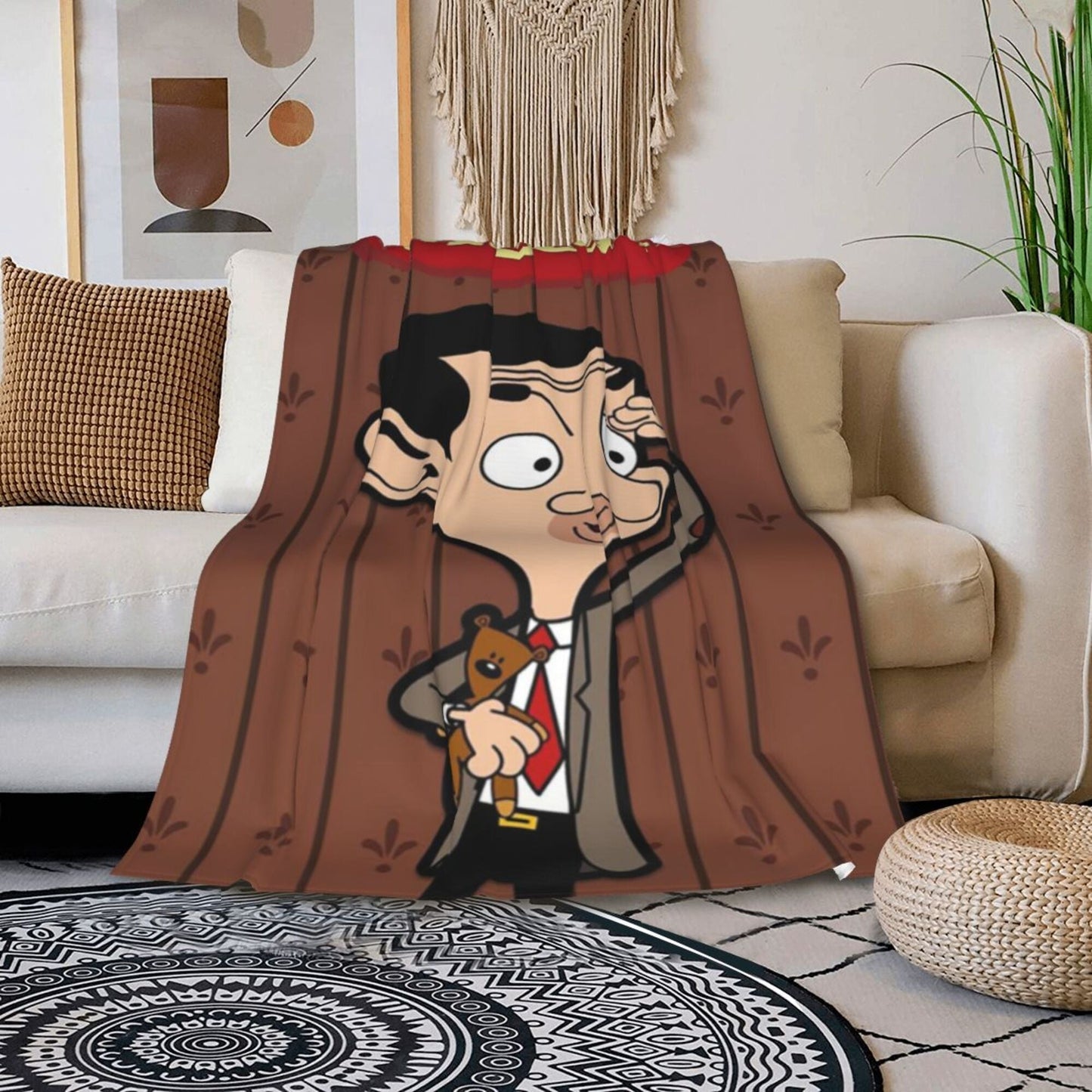 Soft, lightweight Mr. Bean flannel nap blanket, the perfect stress-relief throw for office naps. Ideal for all seasons, this cozy cartoon blanket is made of polyester and makes a great gift for friends and family. It features a digital print, making it a