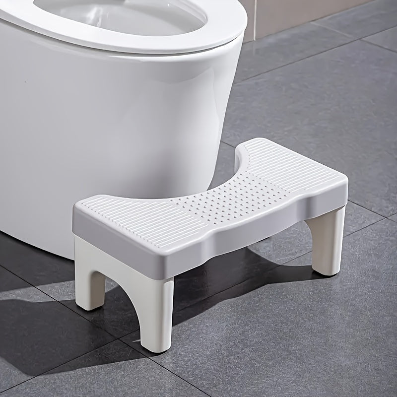 1pc Ergonomic Folding Toilet Step Stool with Durable Plastic Construction and Space-Saving Design, featuring Anti-Slip Feet and a 35-Degree Comfort Angle for Essential Bathroom Aid.