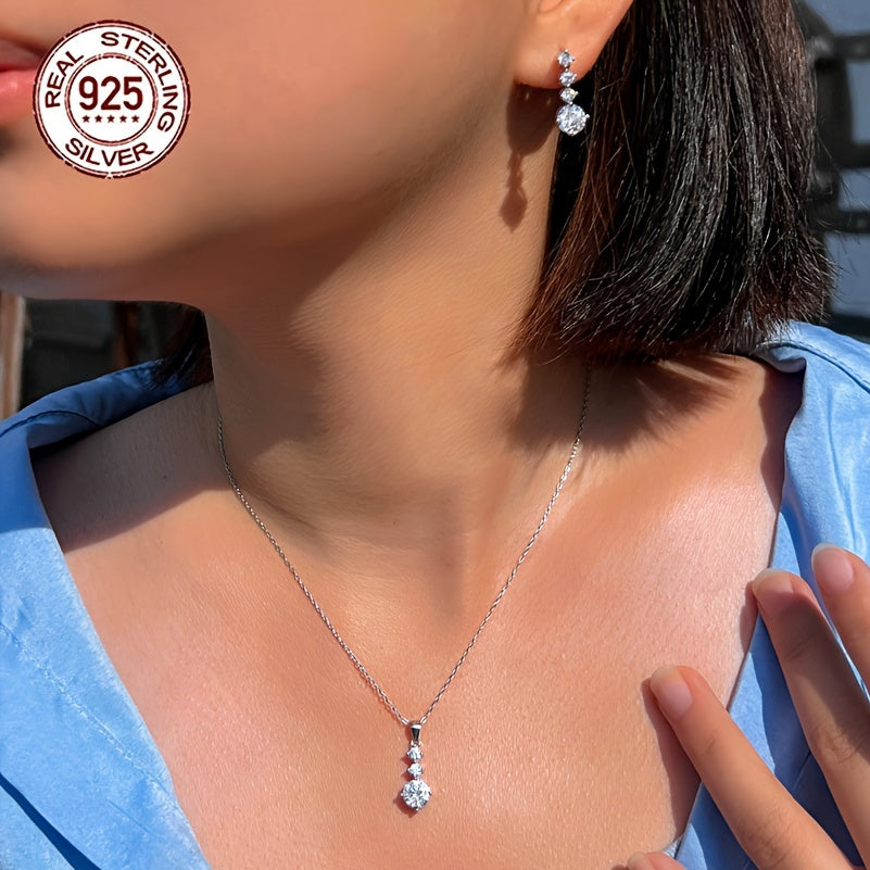 One set of elegant 925 sterling silver jewelry featuring classic 4-roundel drop earrings and pendant necklace with synthetic cubic zirconia. Perfect for daily wear or as a gift for Valentine's Day for women. Silver plated for added shine.