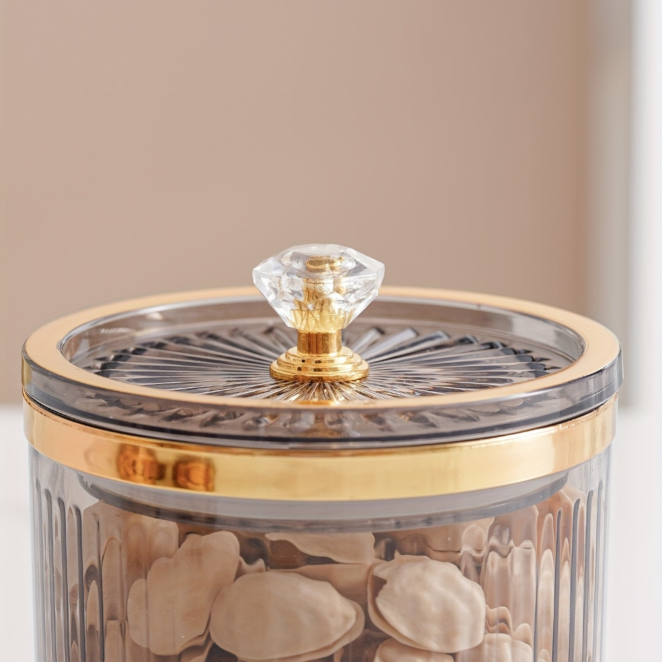 One piece of a transparent amber sketch golden grey bead decorated jar with a lid for candies. Made of plastic, can only be hand washed. It is a reusable sealed fresh-keeping box for storing cereal, rice, pasta, tea, nuts, and coffee beans. Perfect for