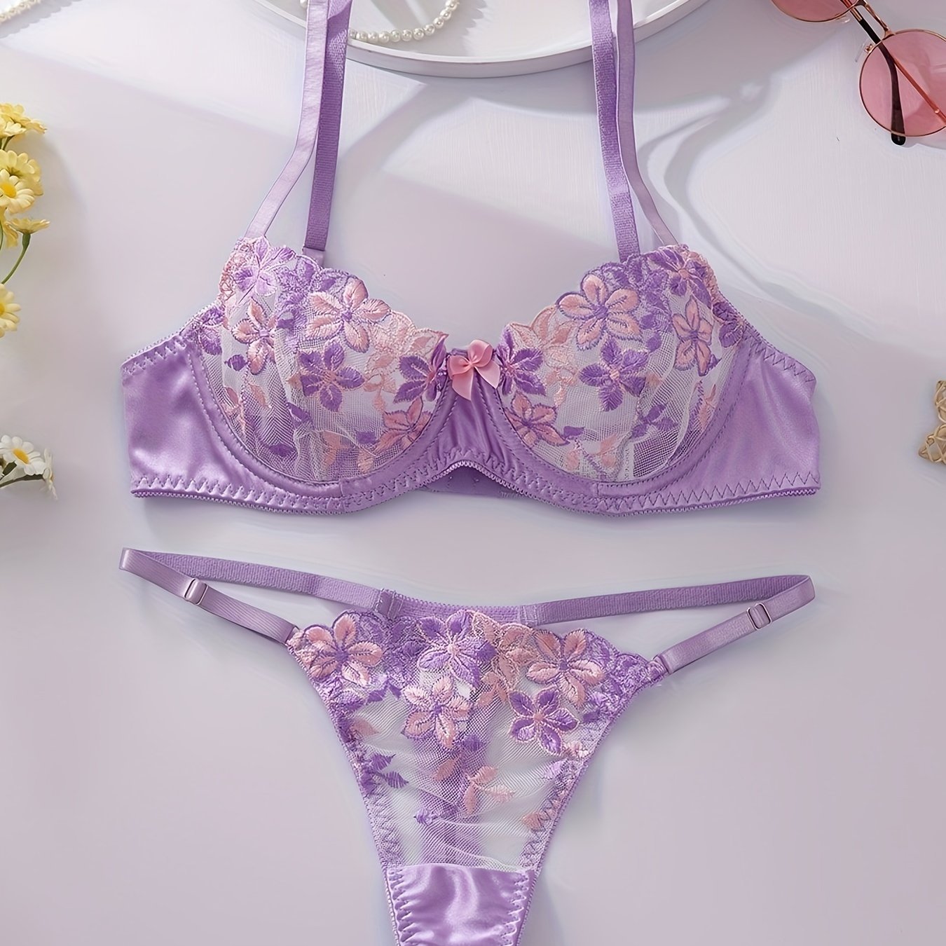 Floral embroidered lingerie set for women, featuring a sexy floral pattern, made from a blend of polyester and elastane. The set includes a medium support bra with underwire and no padding