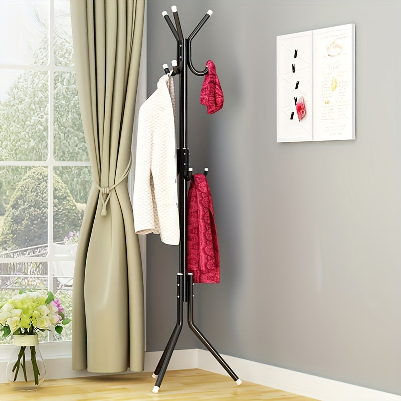 Modern freestanding clothes rack made of wrought iron in black, light blue, and pink. This space-saving design includes hooks for coats, hats, and towels. Easy to assemble and perfect for organizing garments in the bedroom or living room. Can be used for