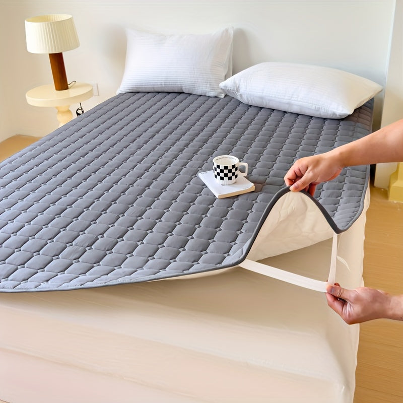 Waterproof mattress topper with machine washable quilted polyester cover, polyurethane liner, and non-slip design for dormitory and home use. 1-piece.