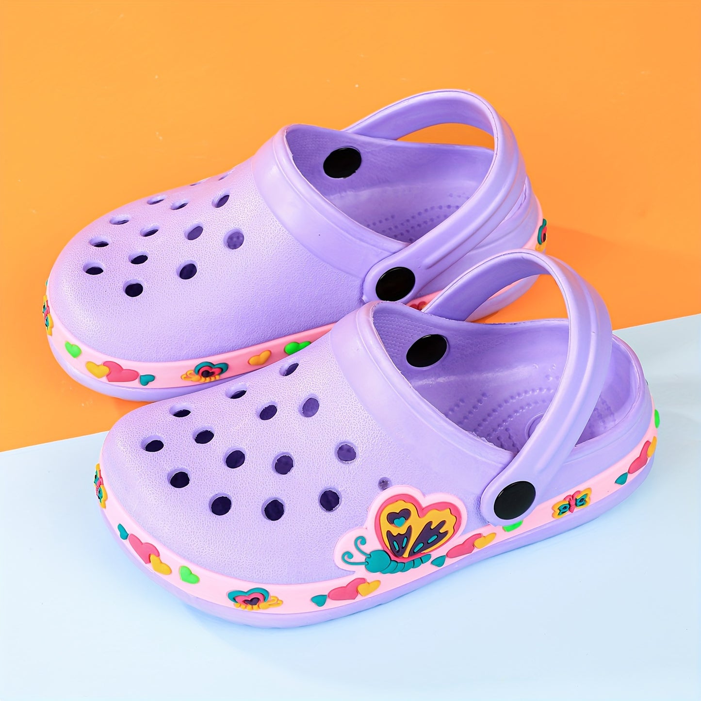 Toddler girls' cartoon print platform clogs with closed toe, anti-skid soles, and hollow out design – perfect for outdoor play.