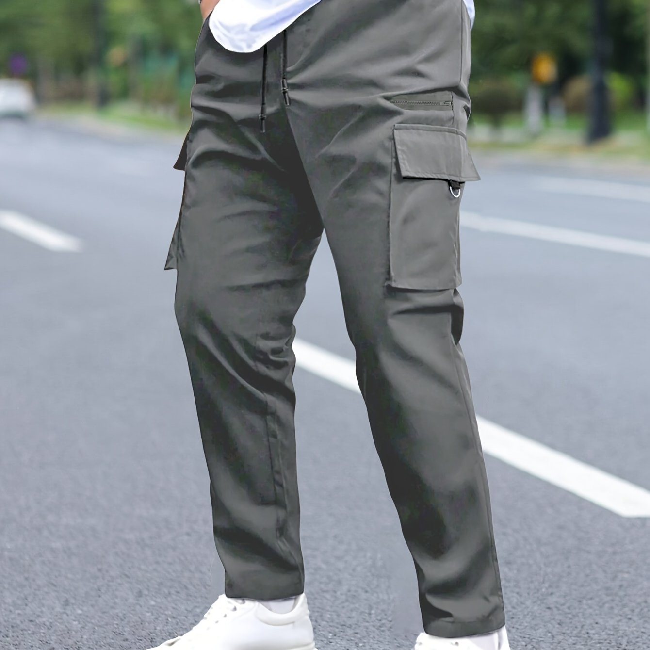 Men's cargo pants with multiple pockets and drawstring for outdoor activities.