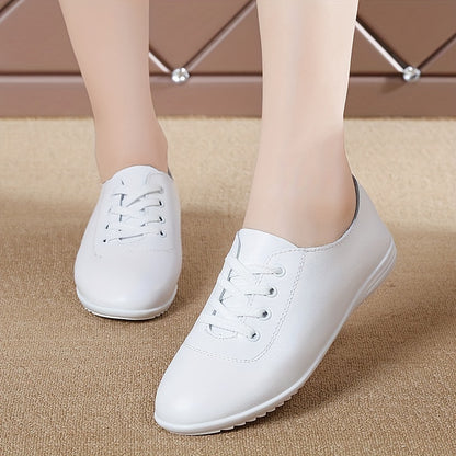 Women's lightweight solid color lace-up flat shoes for casual walking.