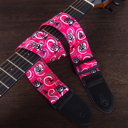 Durable, adjustable faux leather guitar strap in vibrant pink, yellow, and black patterns, suitable for acoustic, electric, and bass guitars.