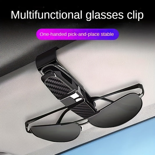 Car visor sunglasses holder with ticket card clamp.