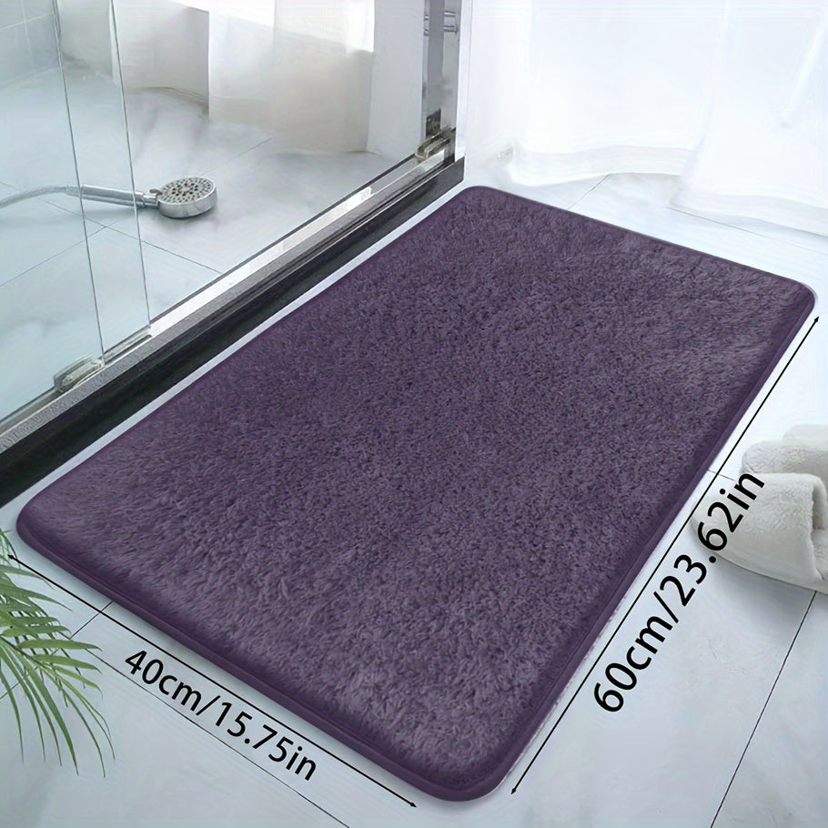 Soft and sumptuous purple bath mat offering luxury feel - highly absorbent, non-slip and fade-resistant, ideal for bathroom, bedroom and laundry room décor. Made from durable polyester, easy to clean.