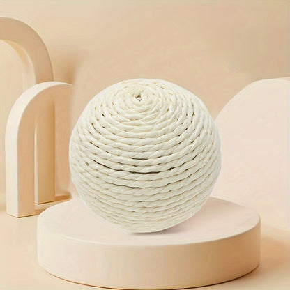 Interactive sound-making cat scratching ball toy made of cardboard material for cats to relieve play with their pet companion.