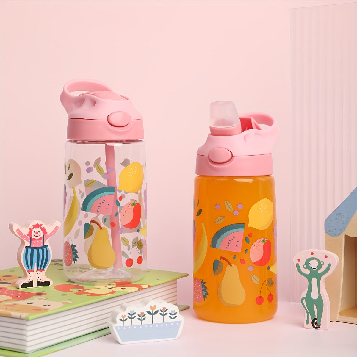 New 500ml BPA-free plastic water bottle with trendy cartoon designs, straw, designed for school students and sports.