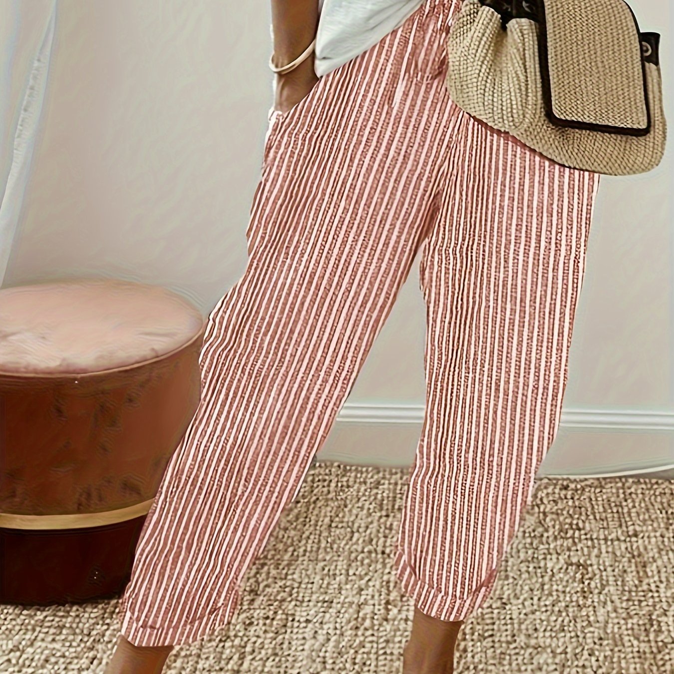 High-waisted, striped wide-leg pants for women made of lightweight polyester. Machine washable with side stripe detail for all-season comfort.