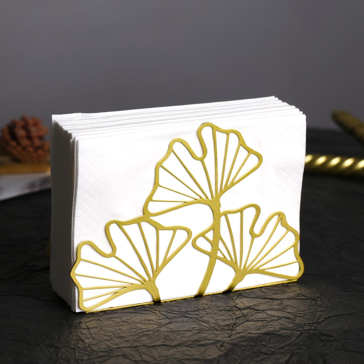 Stylish metal napkin holder with ginkgo leaf design, ideal for dining tables and kitchen decor in restaurants, hotels, and cafes.