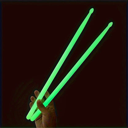 Jazz drumming drumsticks that continuously glow in the dark.