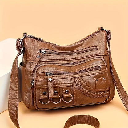 Casual black crossbody bag with multiple zippers for daily use.