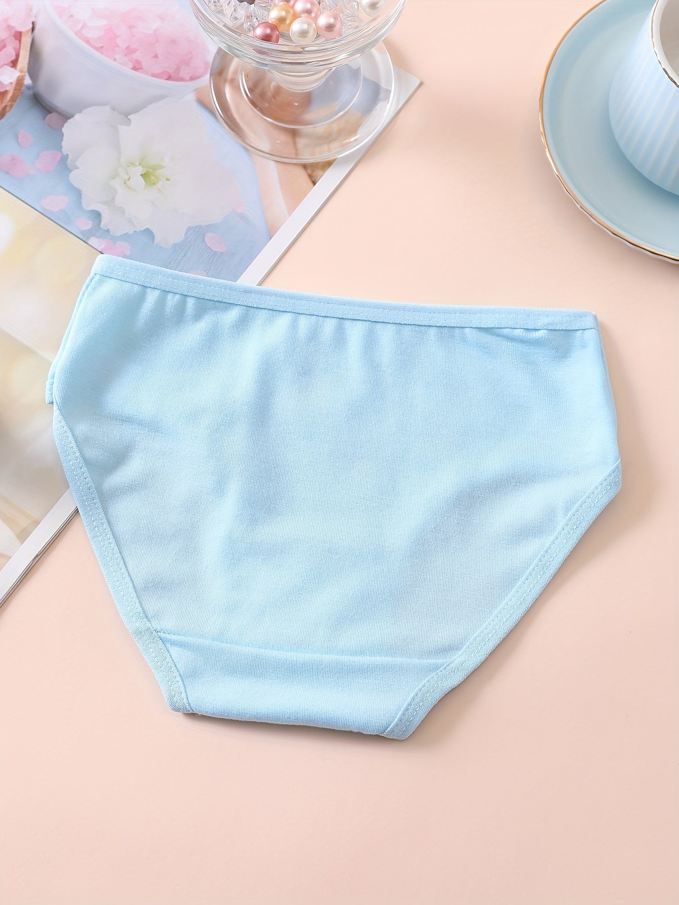 10 pieces of girls' soft and comfortable cotton briefs with cute patterns and breathable fabric.