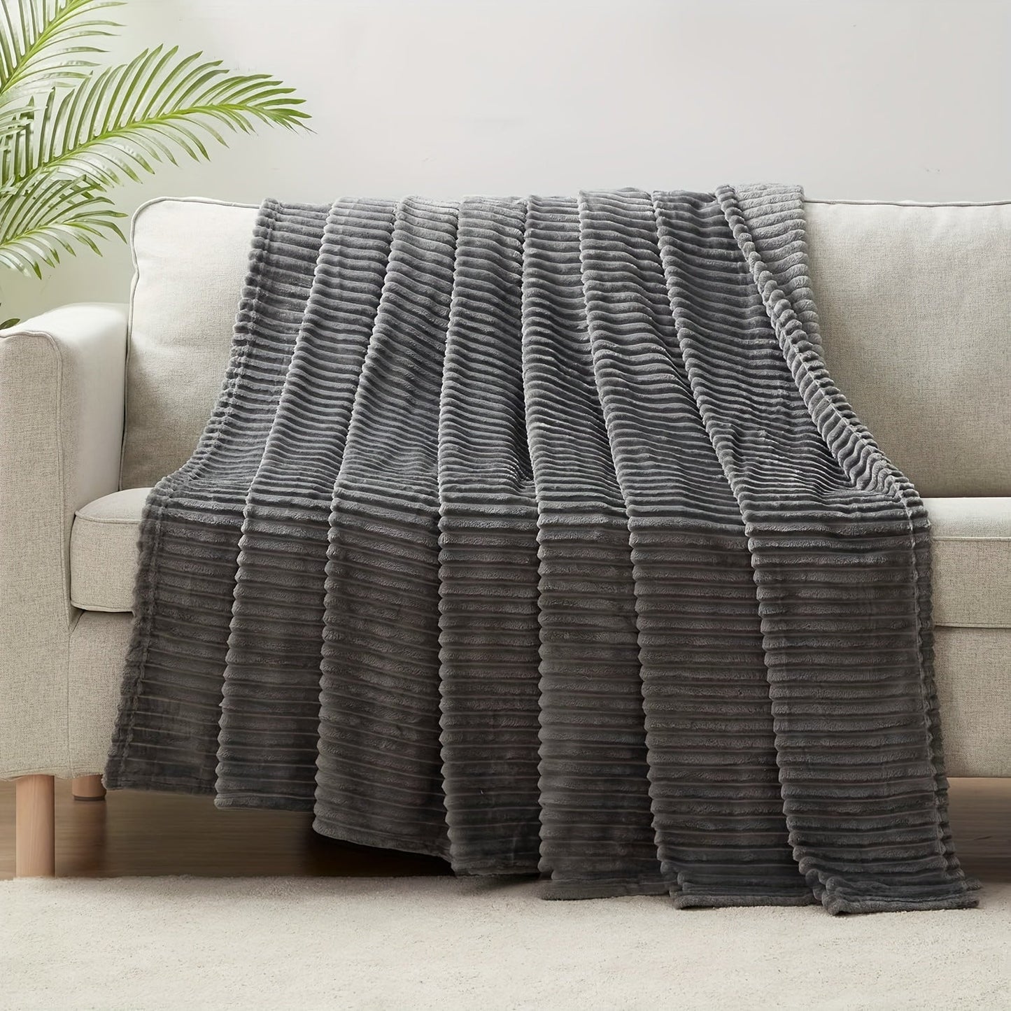 Stay cozy and warm with our Ultra-Soft Oversized Fleece Throw Blanket. Made with lightweight and warm 280GSM microfiber, this blanket features a 3D ribbed Jacquard design for added style. Hypoallergenic and perfect for all seasons, this blanket is a