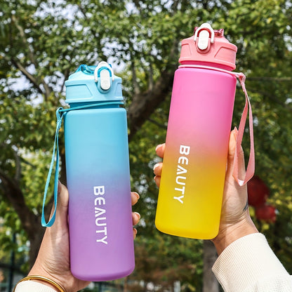 Durable, lightweight, and portable frosted plastic water bottle with scale for outdoor sports and office use.