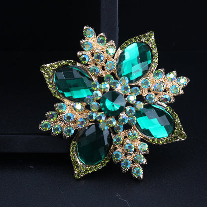 Luxurious Fashion Accessory: Vintage Green Rhinestone Flower Brooch with Baroque Elegance, Quadrangular Cross Design, and Irregular Shape