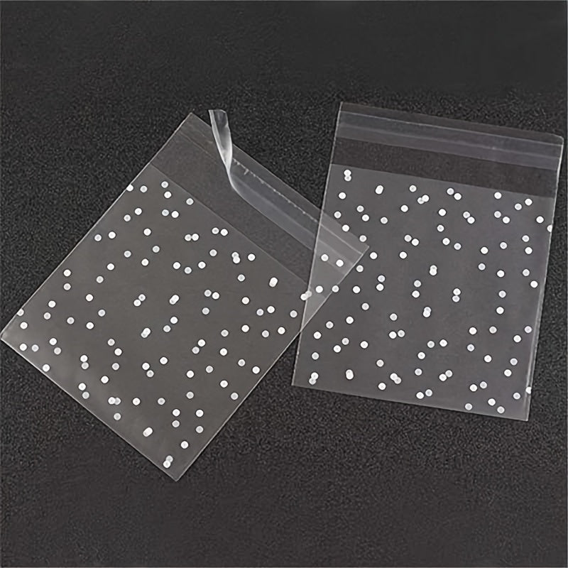 100 pieces of frosted self-adhesive bags with white dots designed for wrapping cakes, chocolates, candies, snacks, and other treats. These clear plastic treat bags can also be used as goodie bags, goody bags, and gift pouches for party supplies.