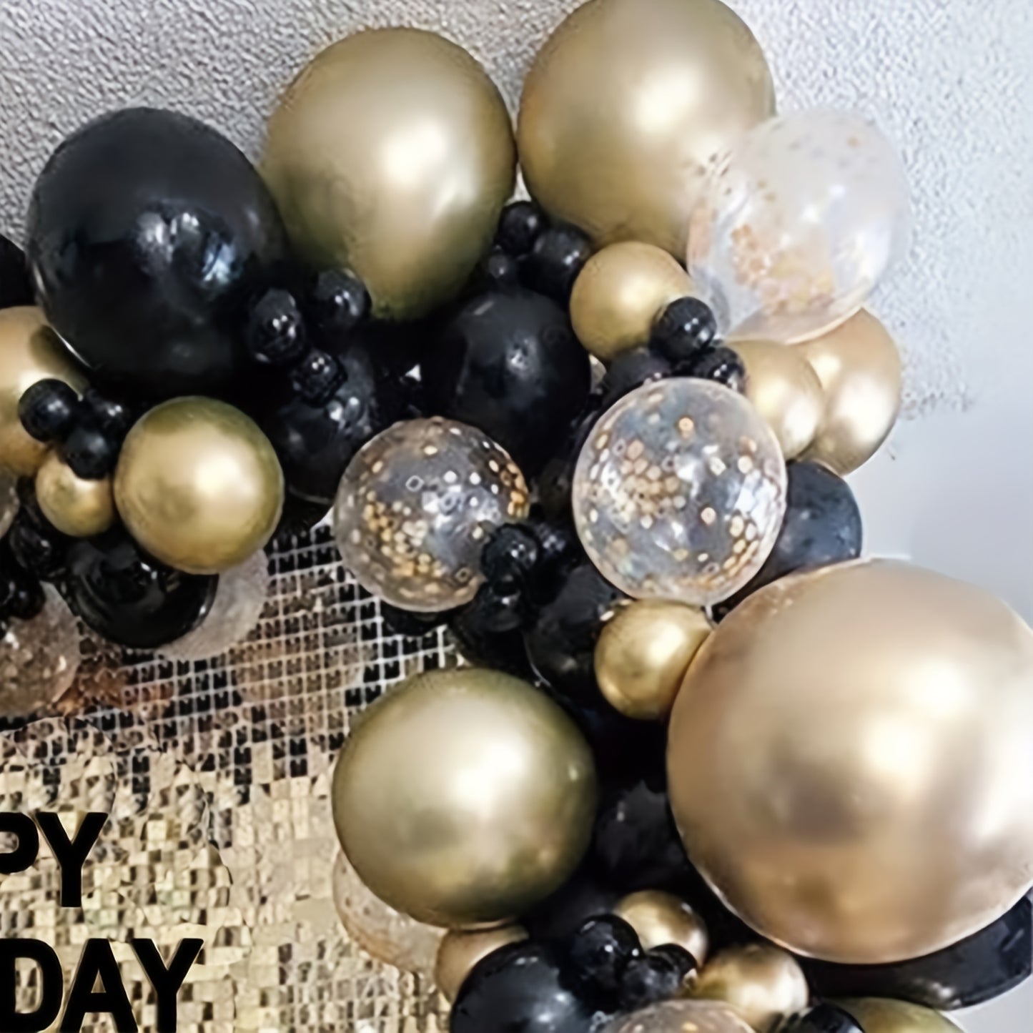 131-piece Black and Gold Balloon Garland Arch Kit including metallic gold and black latex confetti balloons in various sizes for parties and celebrations.