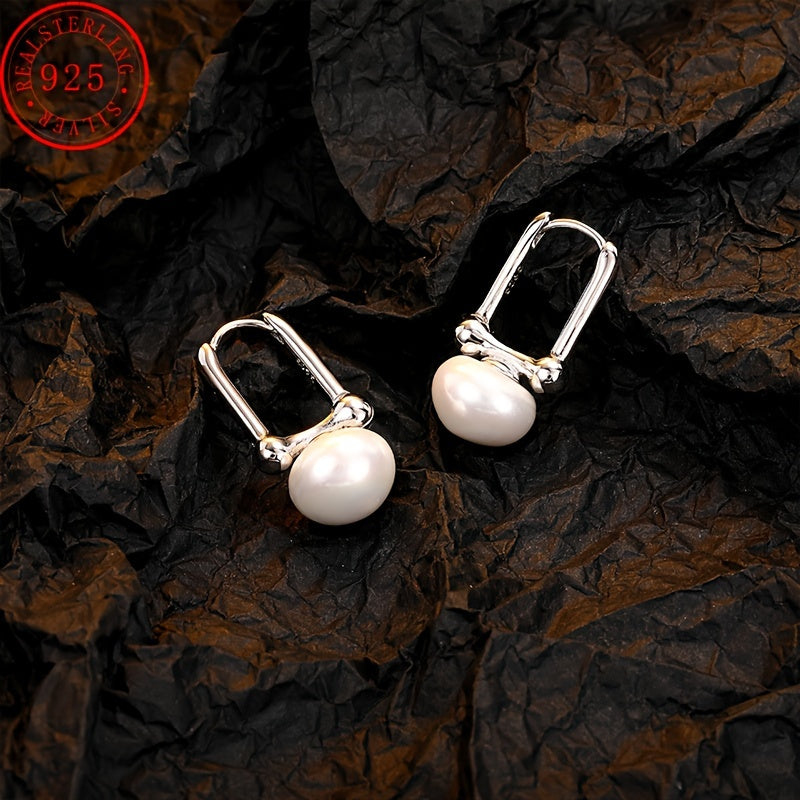 High quality and hypoallergenic jewelry made with 925 sterling silver dangle earrings featuring inlaid freshwater pearls. Perfect for daily outfits or party accessories.