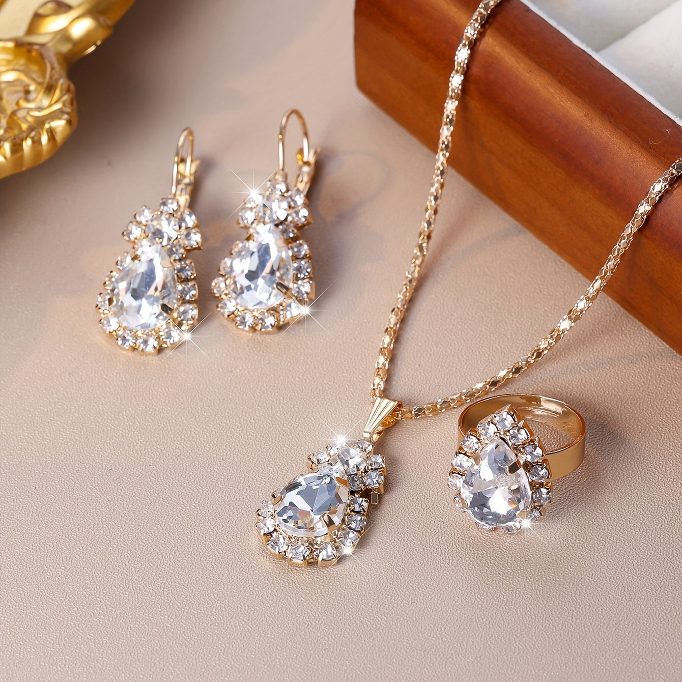 Complete your look with this elegant jewelry set featuring 4 pieces - earrings, necklace, and ring. Made with 18k gold plating and inlaid with shimmering zirconia in multiple colors to suit your style. Perfect for daily wear or adding a touch of glamour