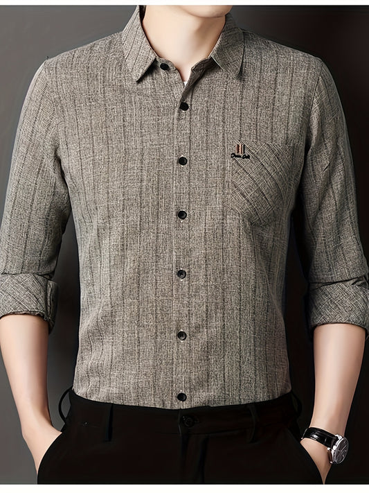 Men's striped shirt with chest pocket, collar, and long sleeves.