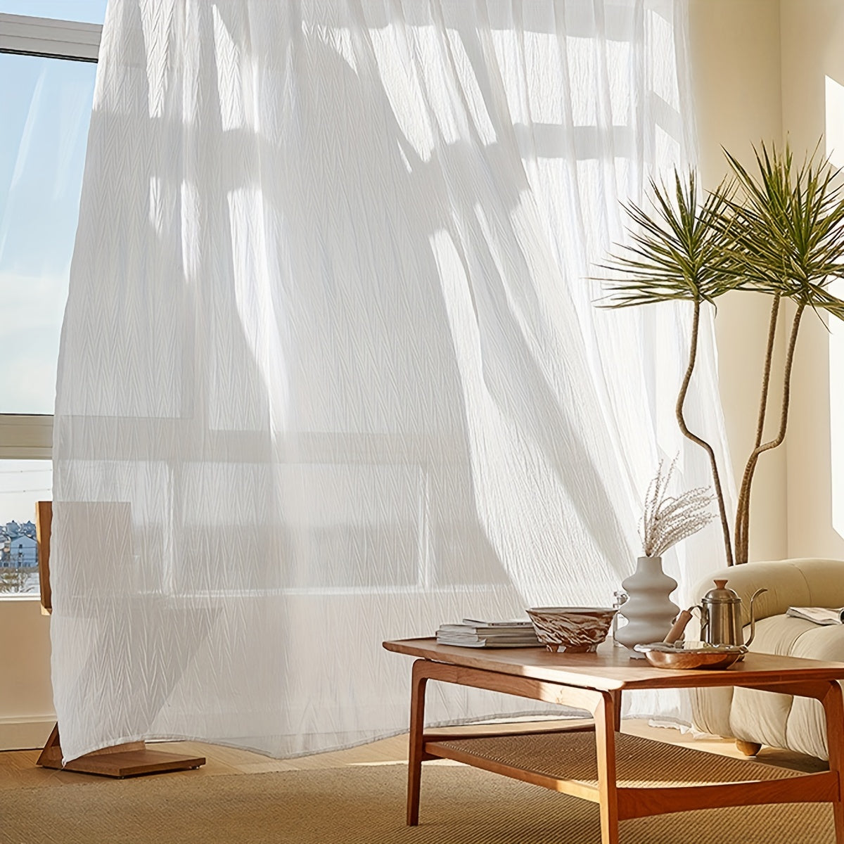 Elegant white sheer curtain with rod pocket, perfect for adding a touch of sophistication to your living room or bedroom décor.