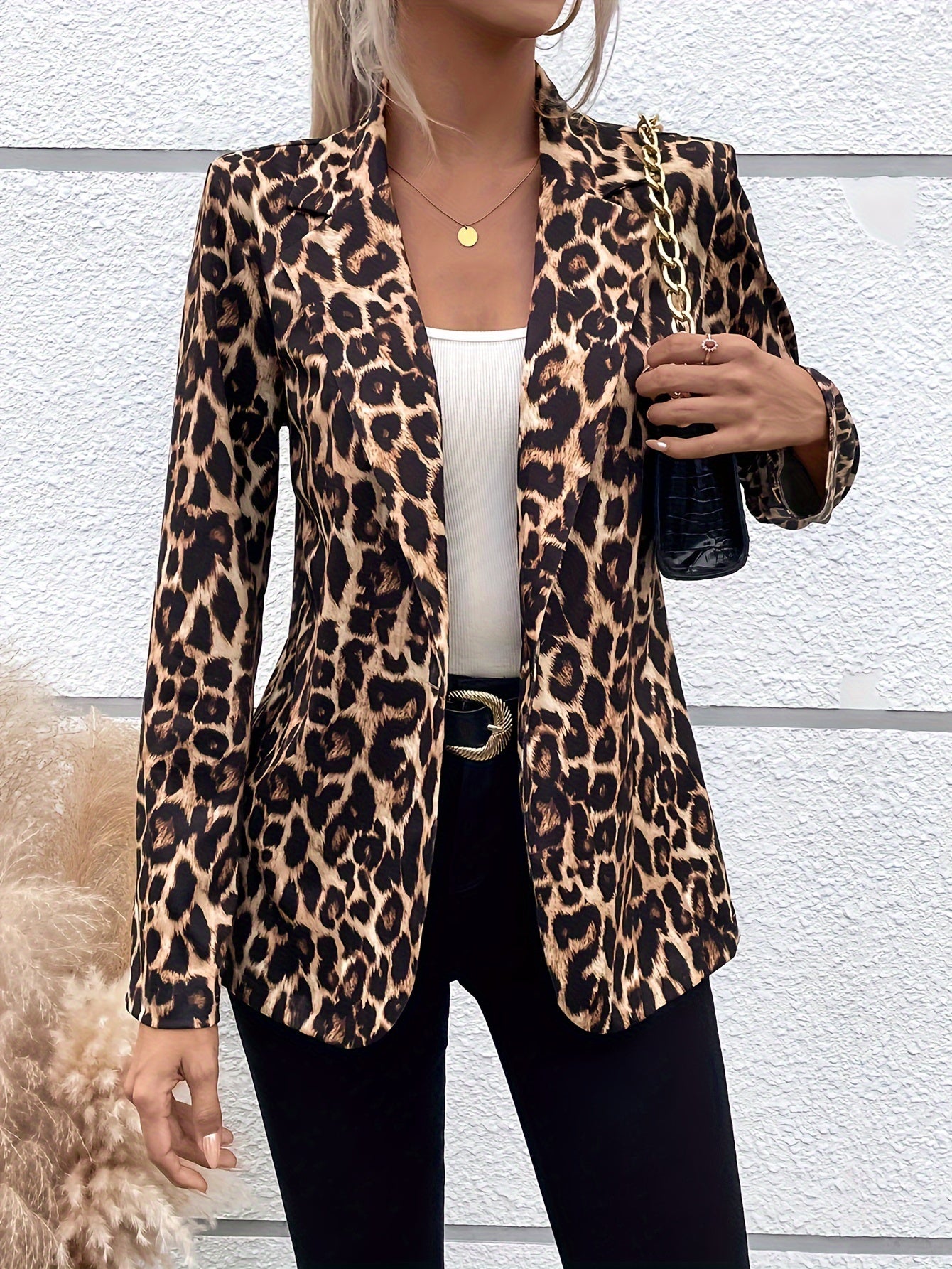 Stylish leopard print blazer for women with long sleeves, lapel collar, and button front. Suitable for both office and casual wear.