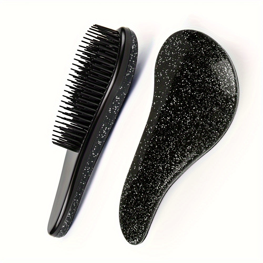 Portable, tiny massage comb for detangling hair with a starry sky design.