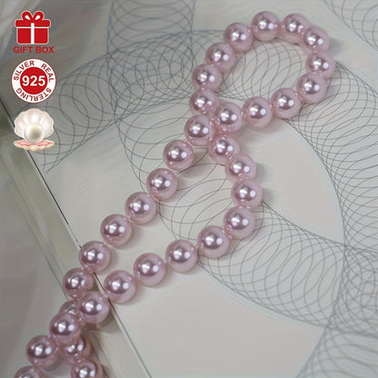 This stunning Cherry Blossom Pink Shell Pearl Necklace is crafted with hypoallergenic 925 Sterling Silver and features a vintage charm clasp. It makes the perfect gift for her and comes beautifully presented in an elegant gift box, making it ideal for