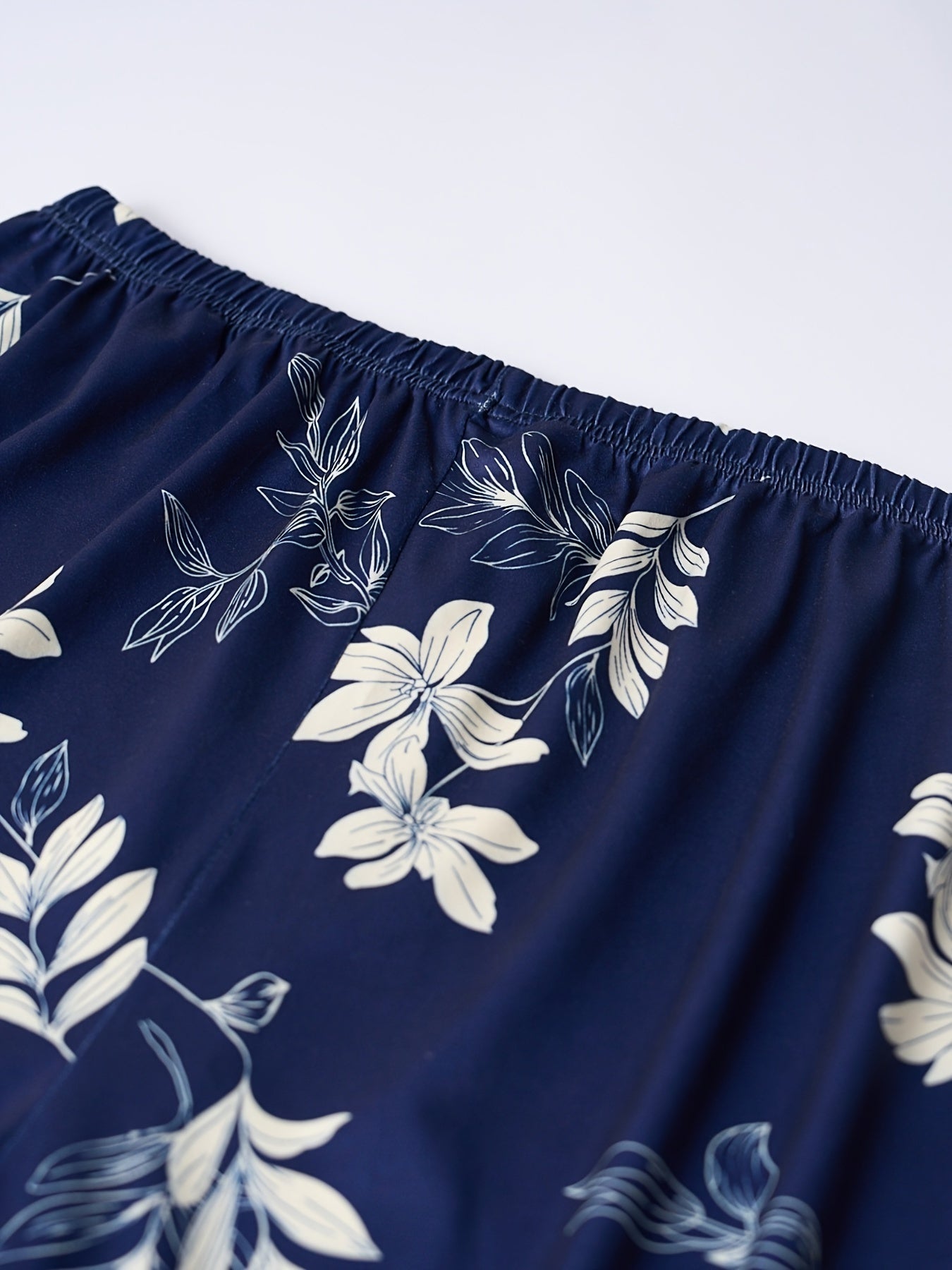 3 women's plus casual sleep shorts with floral print and elastic waist.