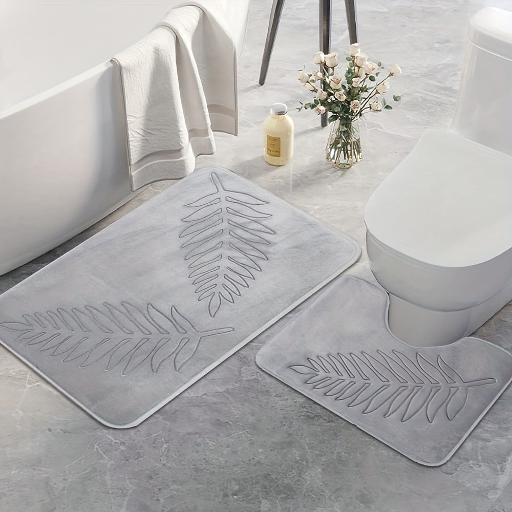 2-piece set of plush memory foam bathroom mats with a fern leaf design. These mats are non-slip, absorbent, and machine washable, making them perfect for adding a touch of style to your home decor.