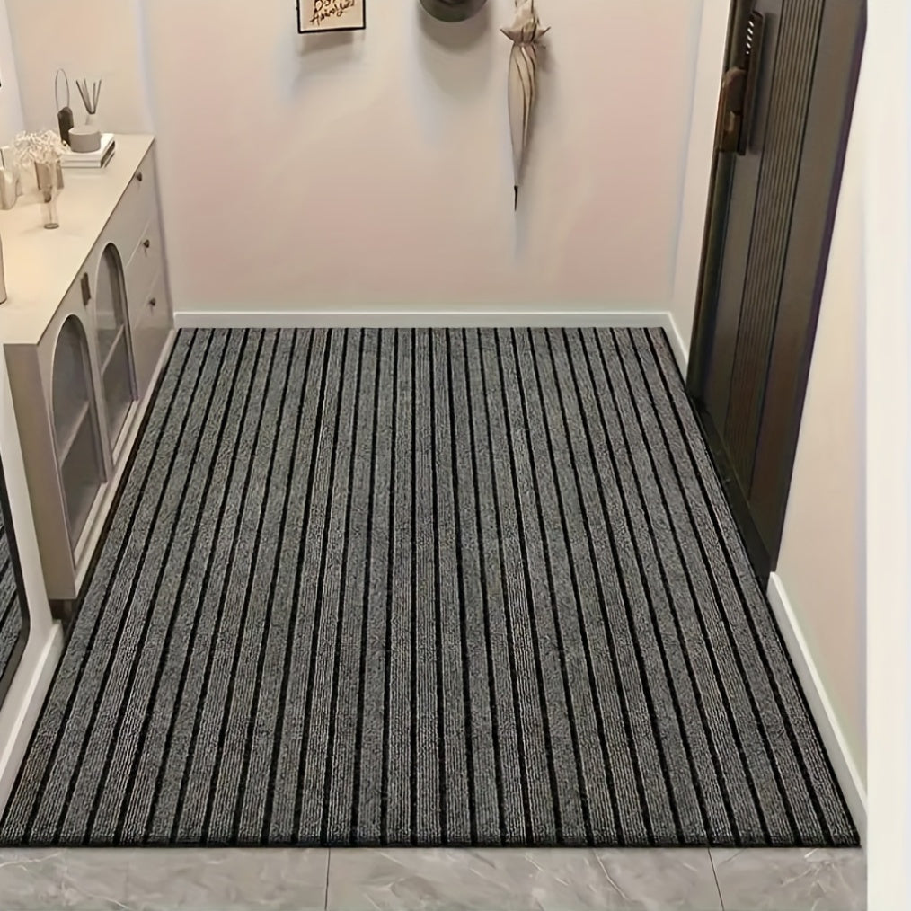 Household mat in gray stripes, designed to prevent slipping and repel dust and stains. Suitable for indoor, kitchen, and bedroom use. Can be cut to size with options available in various dimensions (101.6cm x 152.4cm, 127.0cm x 203.2cm, 114.3cm x 3.05m