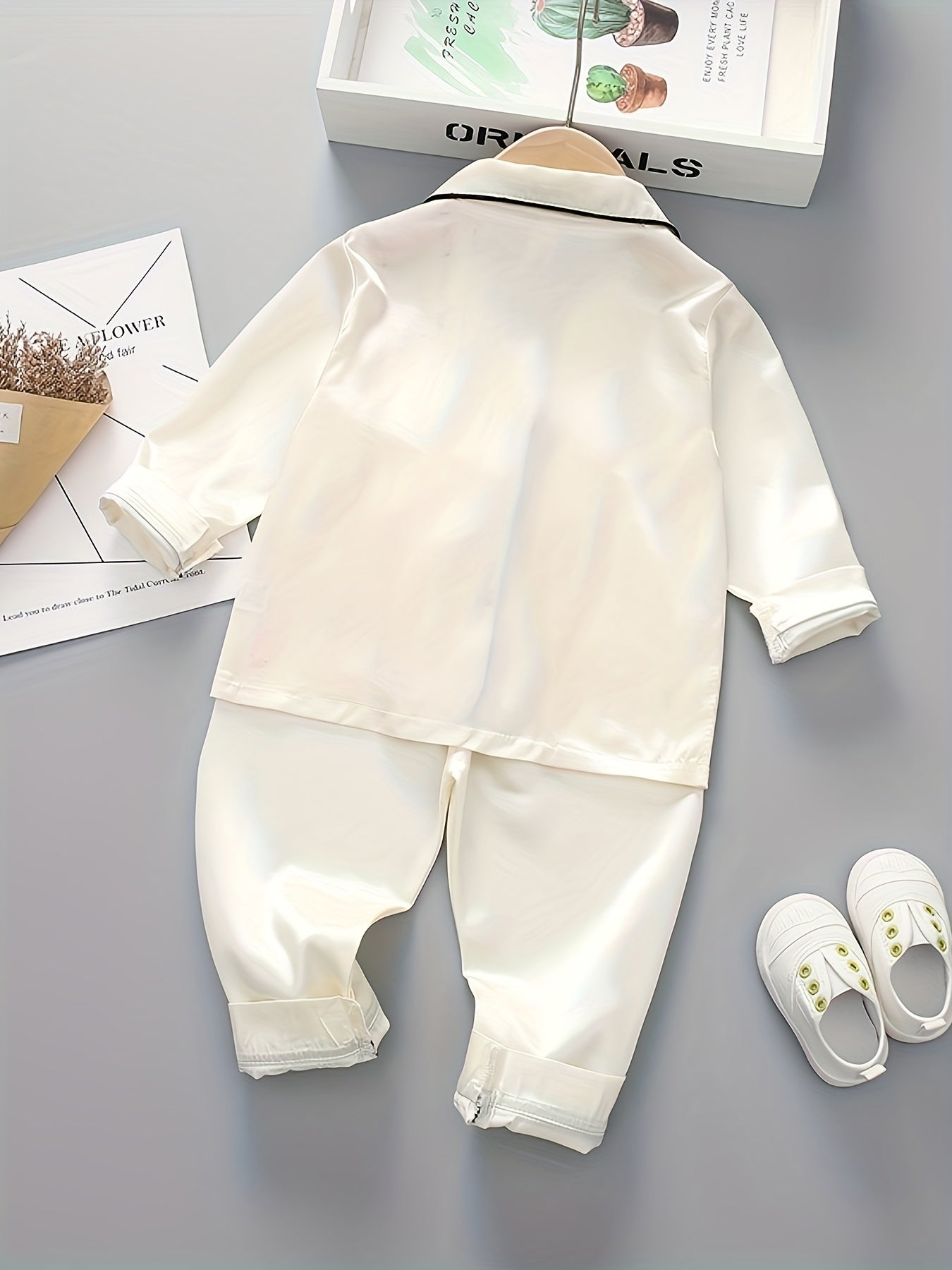 Boys' classic long sleeve pajama set made with polyester, featuring a lapel collar, button front, and regular fit for spring/fall.