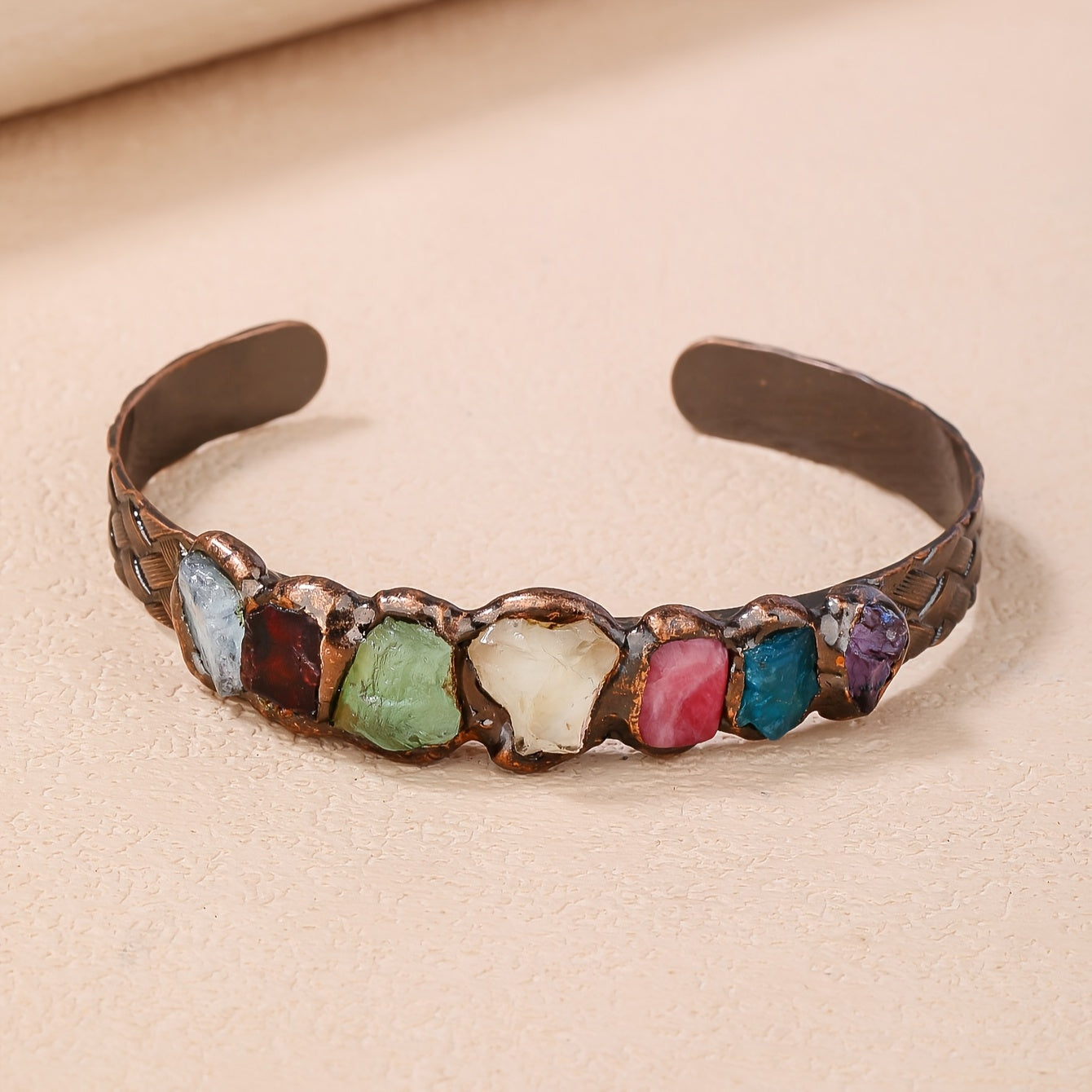 Handmade Bohemian Copper Cuff Bracelet adorned with 7 gemstones, featuring a unique burnt welded design. This beautiful piece showcases a vibrant mosaic of natural rock crystals, making it a perfect accessory for summer parties and Mardi Gras