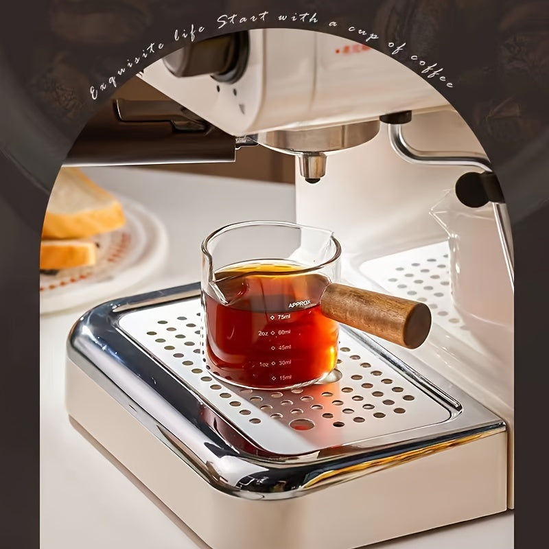 Small and stylish, this 2oz measuring cup features a heat-resistant glass body and a convenient wooden handle for easy use. With dual spout, scale markings, and ideal for measuring small quantities, this cup is perfect for both coffee and kitchen use.