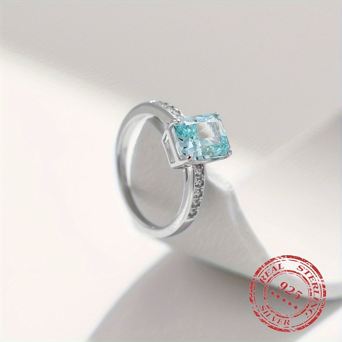 YANLOK presents a stunning 925 sterling silver ring with Paraiba blue cubic zirconia, ideal for gifts and special occasions. This elegant vintage-inspired piece exudes a festive sparkle that is sure to impress.