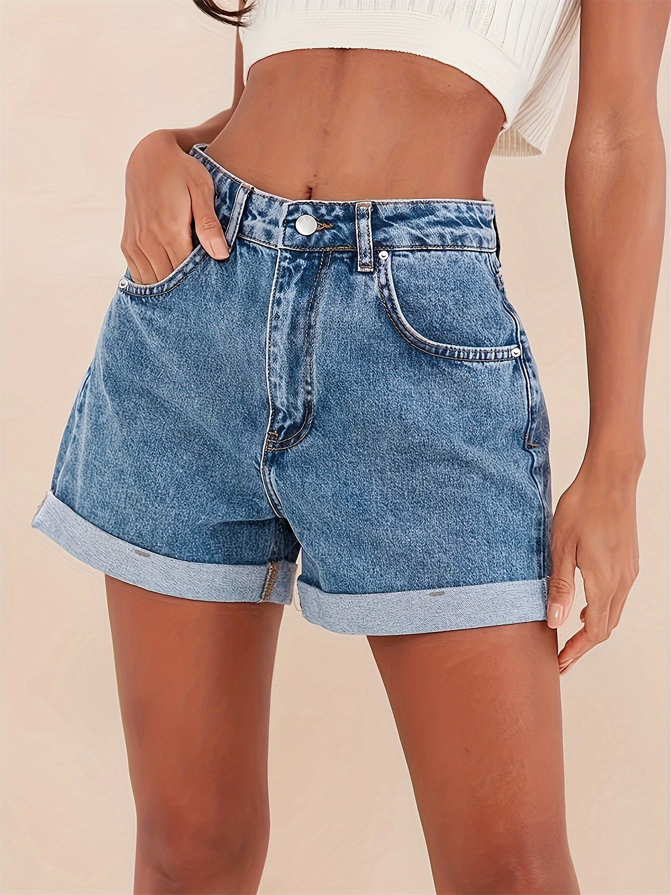 Preppy high-waisted denim shorts for women with flip hem, solid washed color, perfect for spring/summer.