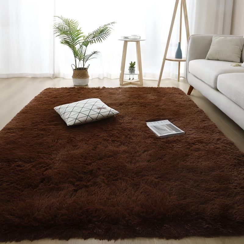 Luxurious soft plush faux fur area rug with anti-slip knitted polyester backing. This machine-made thick, warm, and fluffy mat is perfect for bedroom and living room use. It is hand washable and stain-resistant, making it easy to care for and