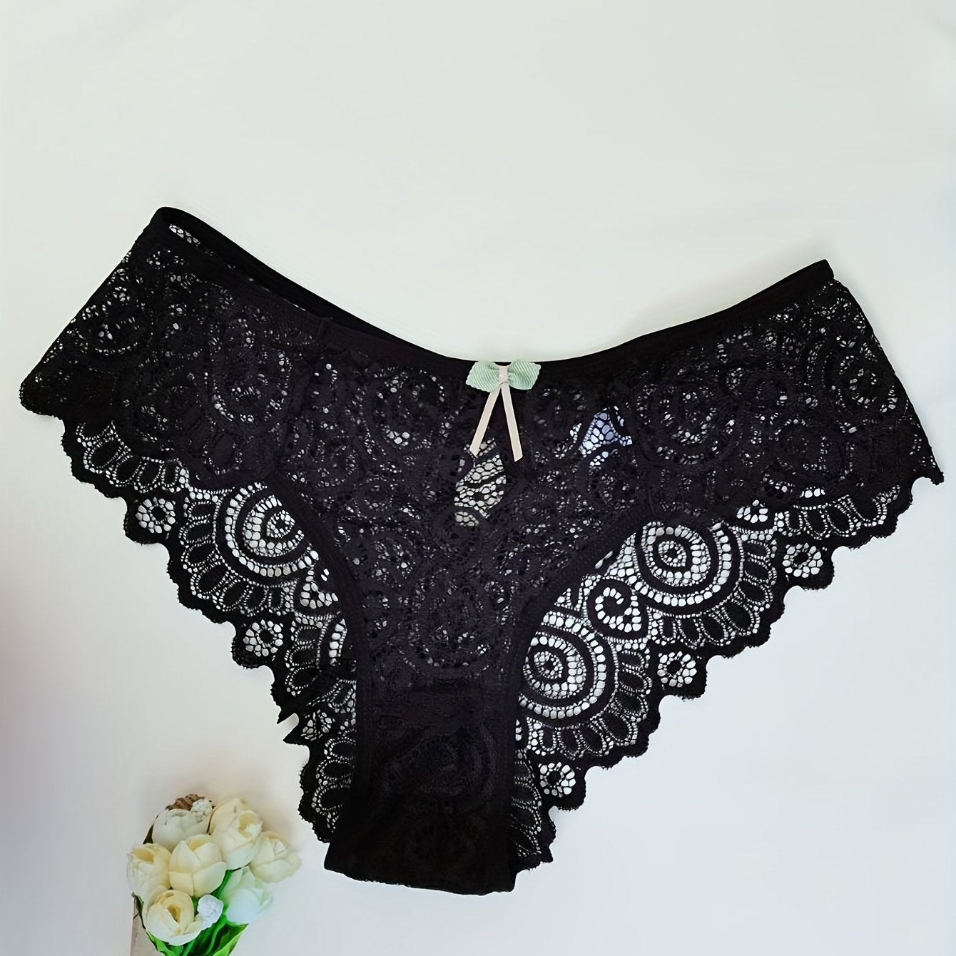 Women's low waist panties made of floral lace with cut outs, breathable and semi-sheer.