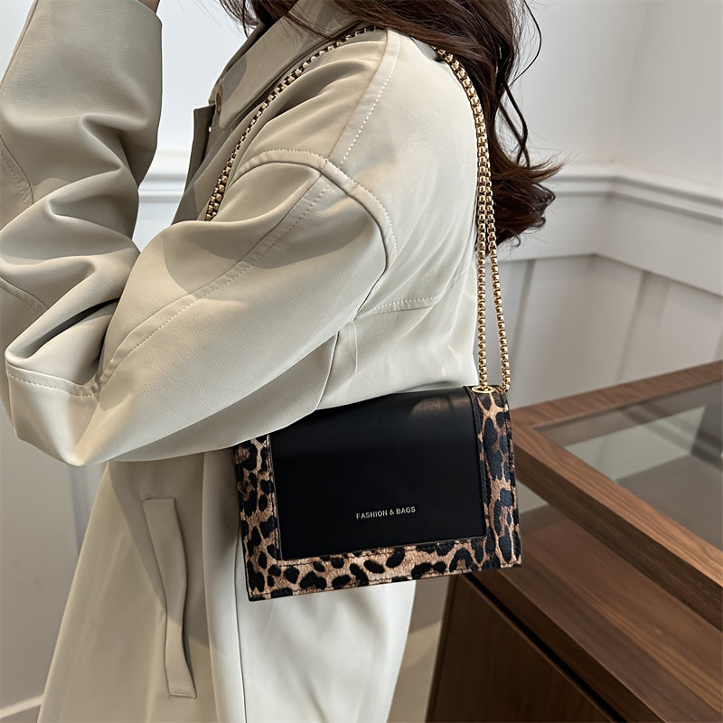 Stylish leopard print crossbody bag for women in black synthetic leather with golden-tone chain strap. Magnetic closure and large capacity, suitable for work, travel, and everyday use.