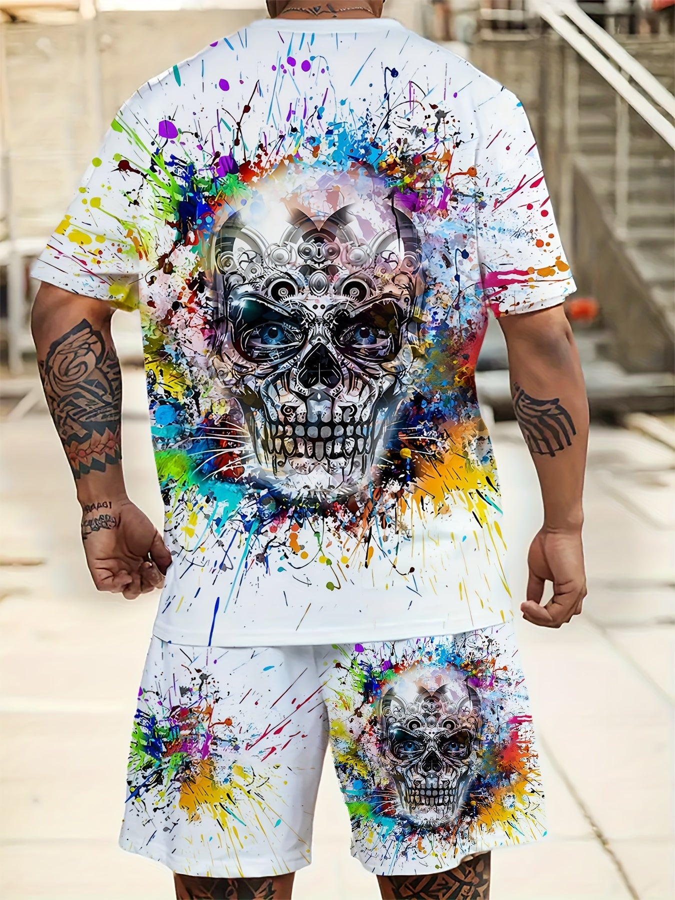 Men's plus size 2-piece set with skull print crew neck t-shirt and drawstring pocket shorts in 100% polyester knit fabric with slight stretch and regular sporty fit. Features vibrant paint