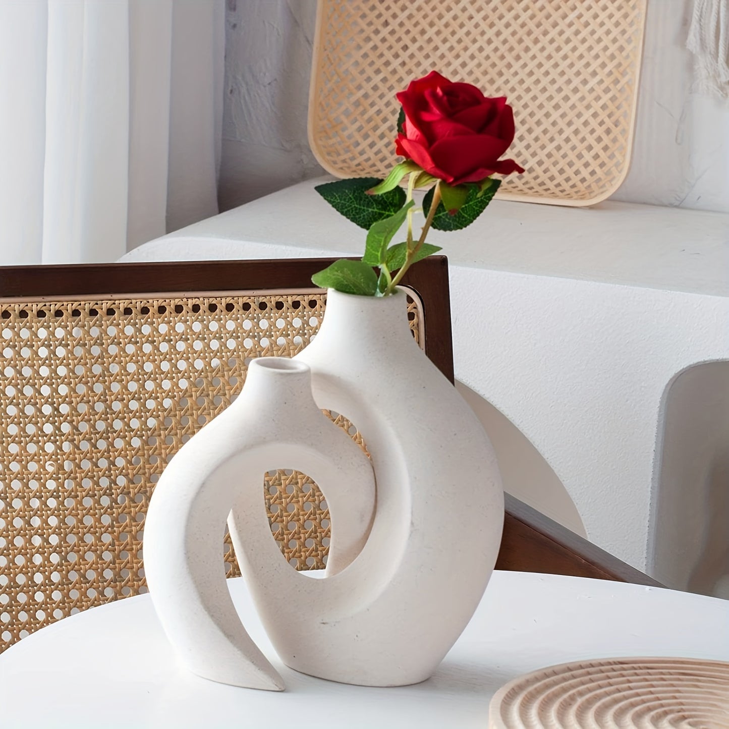 The handcrafted vase features a unique scene of couples cuddling, with two separate vases and a hollow middle that doubles as a work of art, creating a modern atmosphere no matter where it is placed.