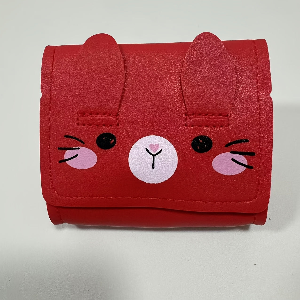 Cute bunny-themed mini crossbody bags in faux leather with adjustable strap. Includes cartoon coin purse and shoulder handbag in various colors. Bunny accessories available.