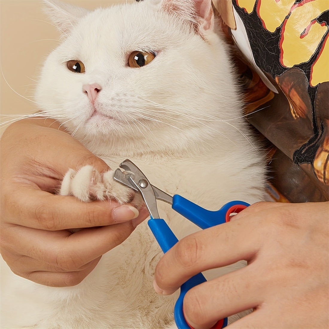 Stainless steel nail clippers for small pets with comfort grip handle.