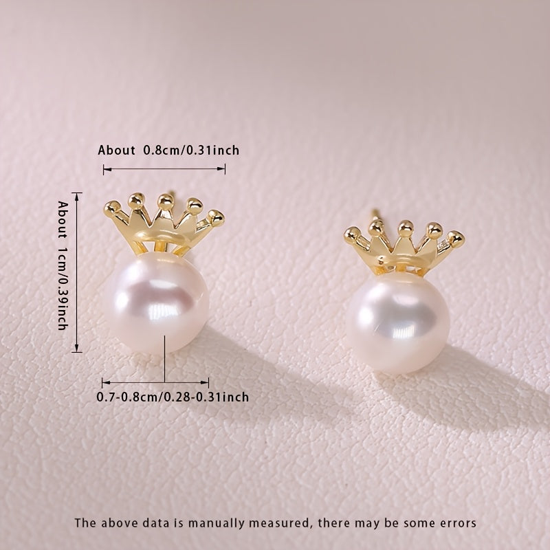 These MUFAN Elegant Luxury Stud Earrings feature a pair of 7-8mm Flat Round Natural Freshwater Pearls adorned with a Small Crown design. They are the perfect June Birthstone accessory for daily wear or gifting, making them a versatile choice for all